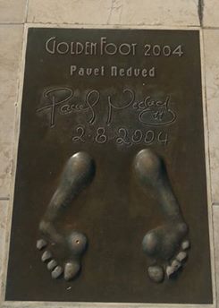 A golden cast of Nedved’s footprints. His signature and the date are recorded at the top of the image.