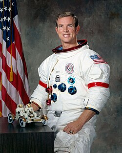 Scott posing with a model of the lunar roving vehicle
